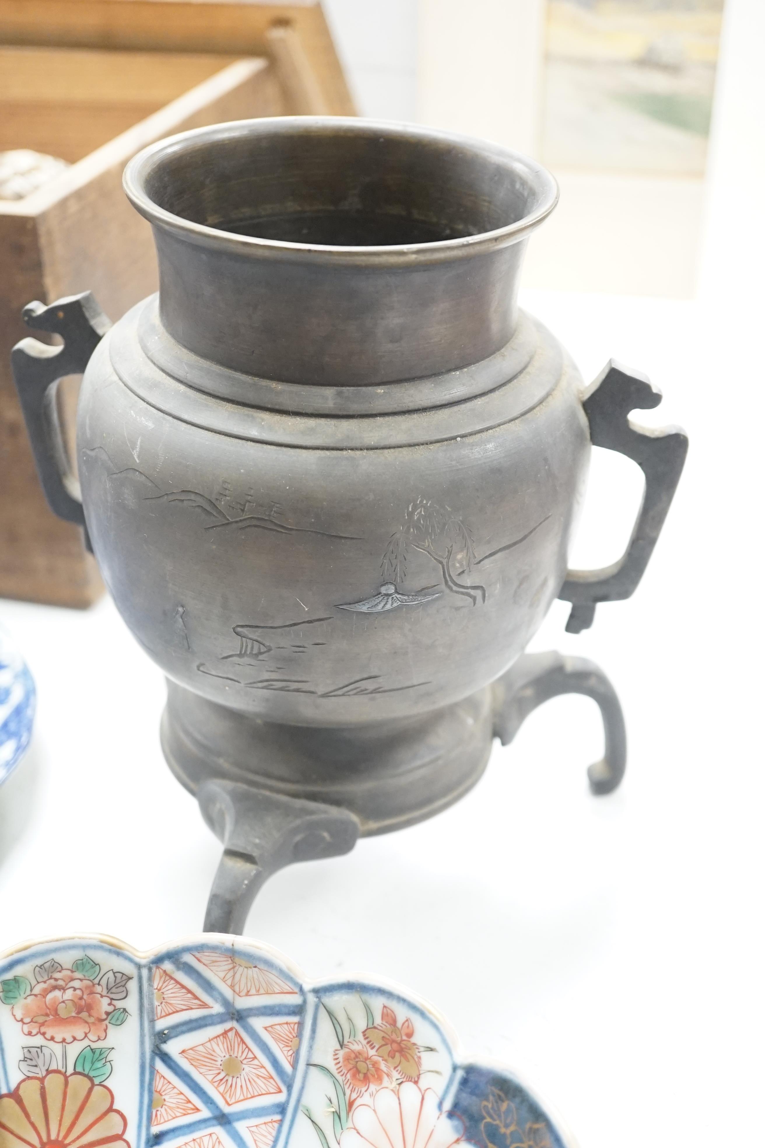 A Japanese bronze and mixed metal tripod vessel, a pair of 19th century Japanese Imari scalloped bowls, 22.5 cm diameter and a blue and white plate